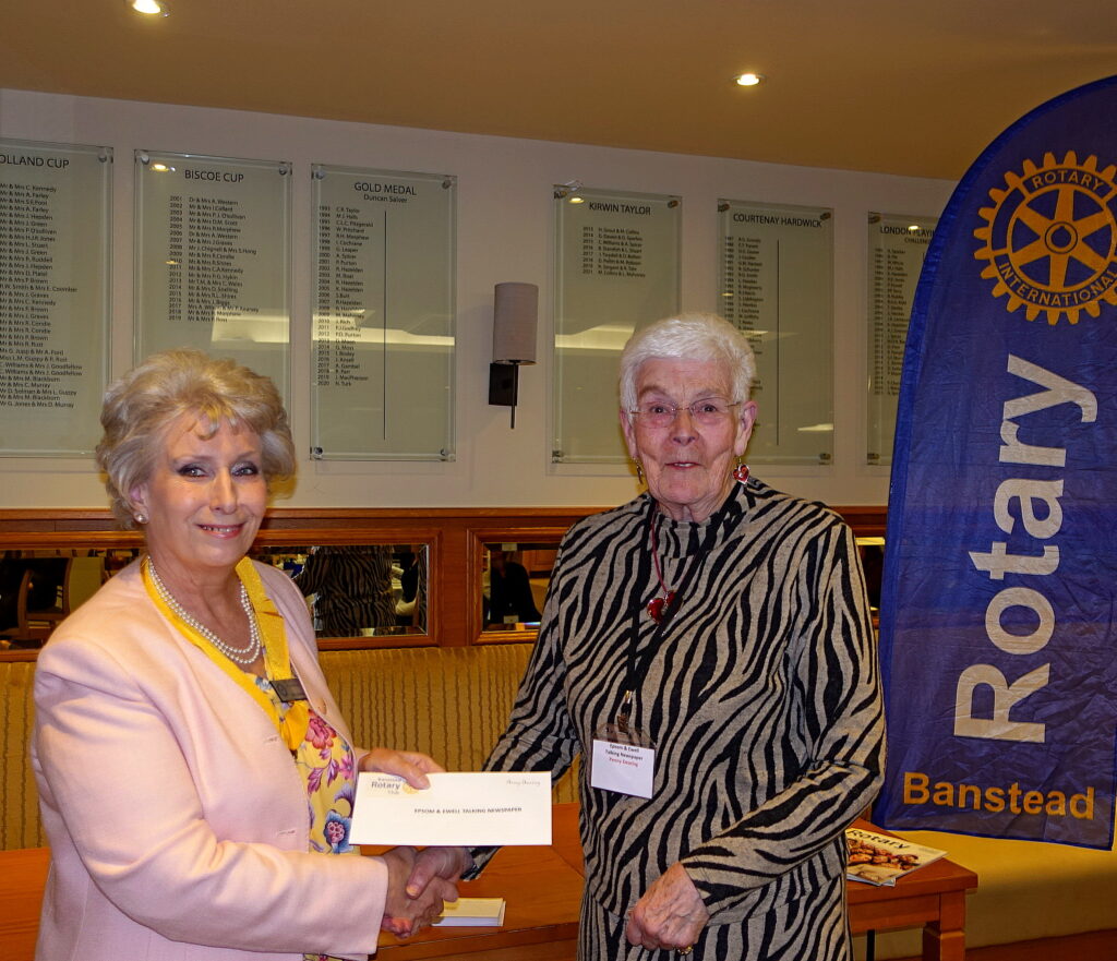 Penny Dearing receiving a cheque