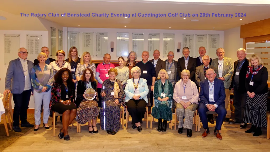 Photograph of Judy and representatives of charities with members of Banstead Rotary Club